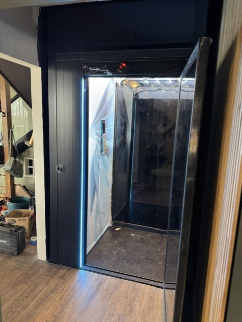 Electric home elevator with doors open