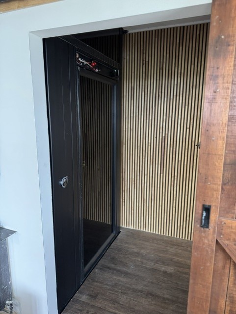Electric home elevator with timber surround