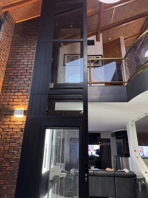 Home elevator in warehouse-style home